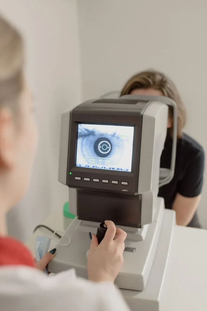 Ophthalmologist performing an eye examination on a patient to screen for diabetic retinopathy