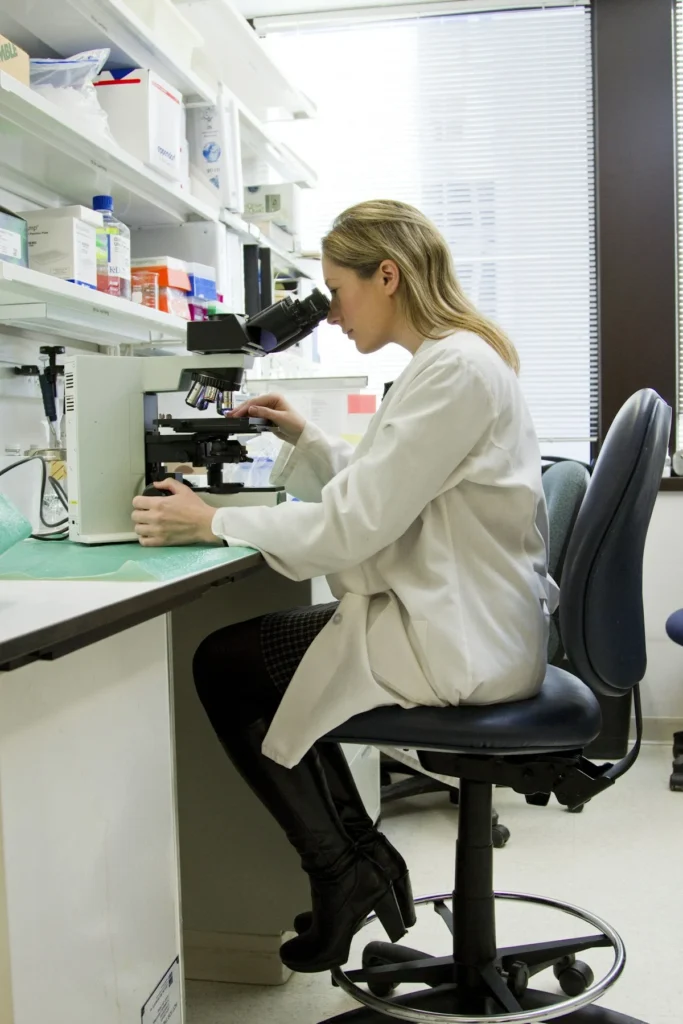Doctor reviewing blood test results showing fasting blood sugar and HbA1c values on a patient chart
