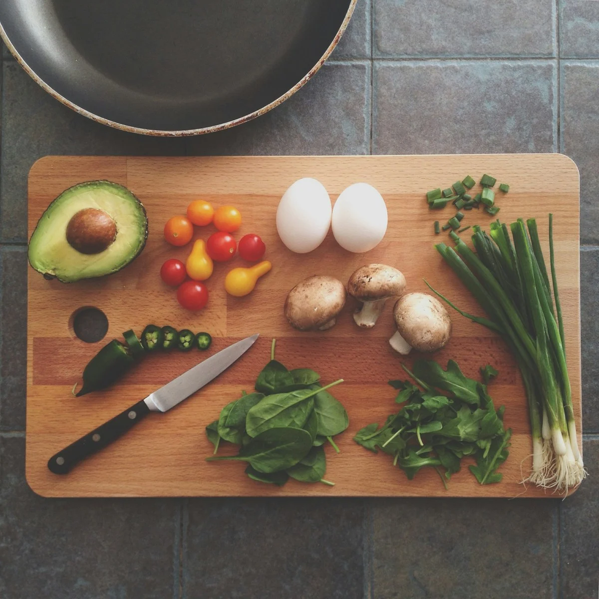 Fresh Indian vegetables including bitter gourd, spinach, and tomatoes for diabetes diet