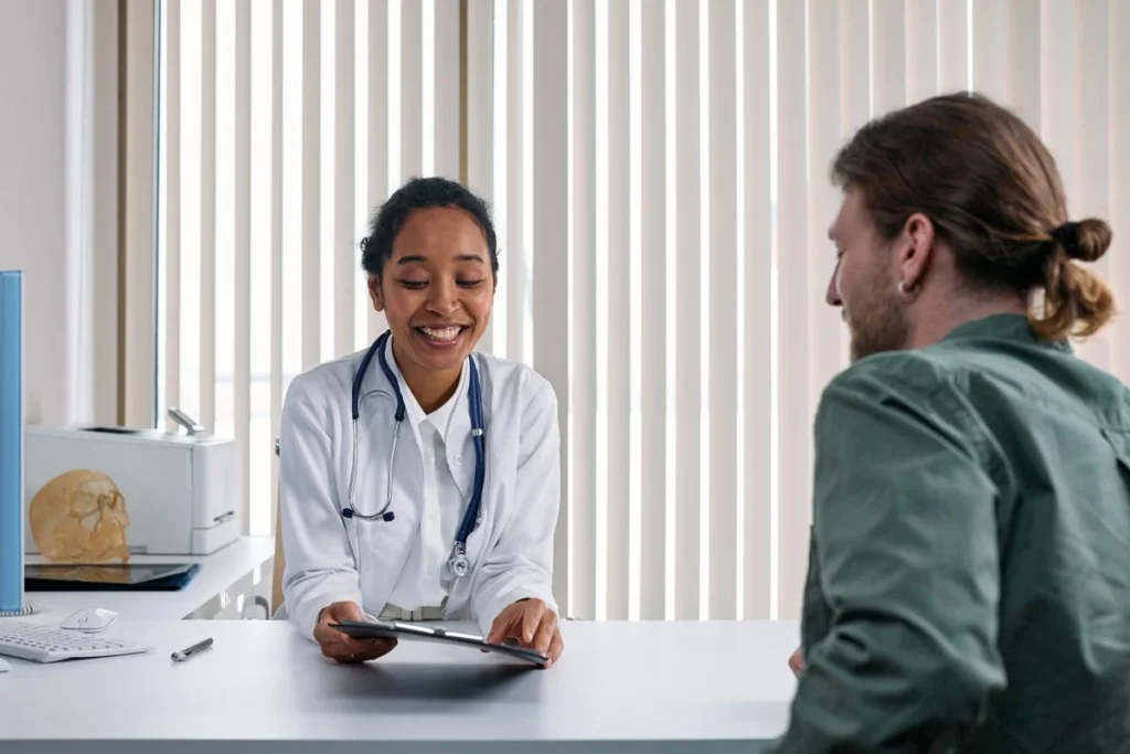 Patient and doctor having a consultation about metformin side effects and weight management goals