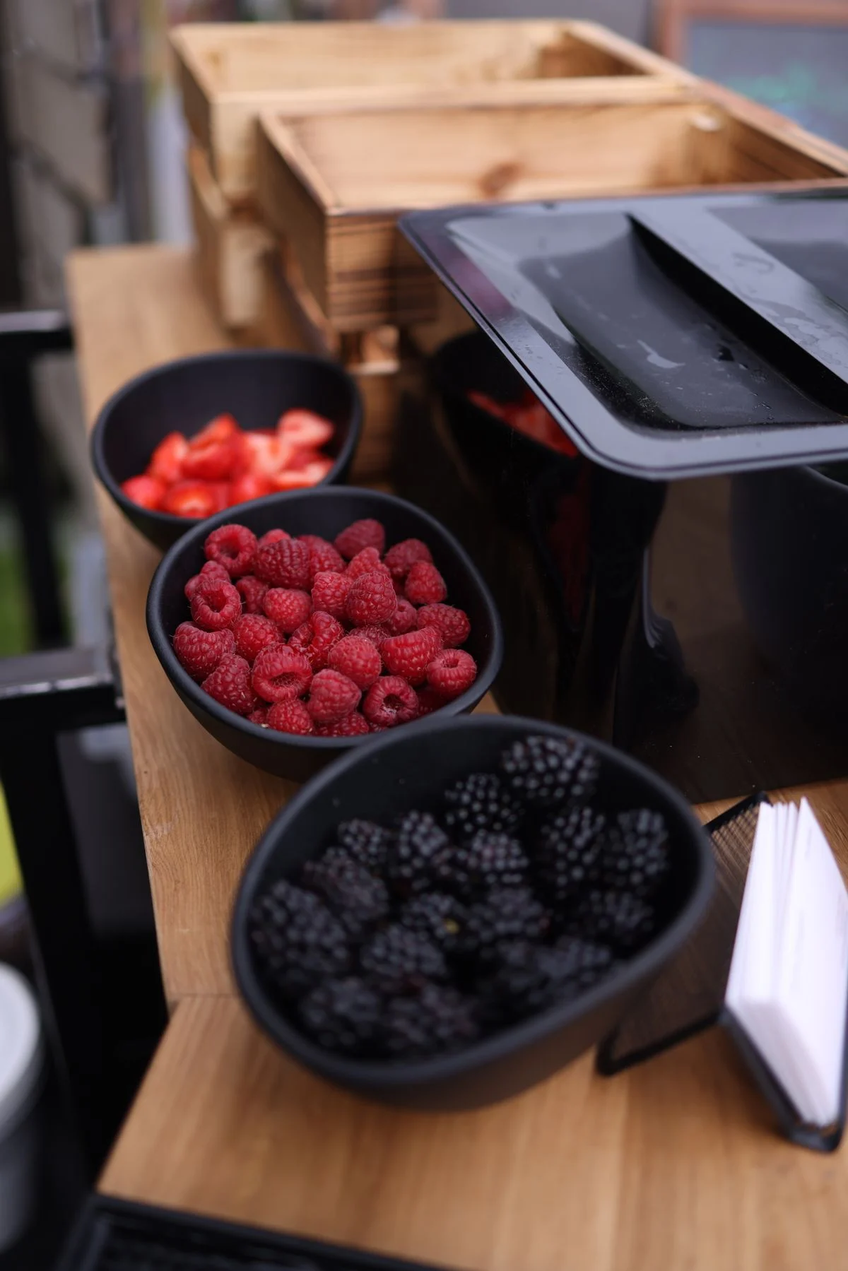 Colourful bowls of fresh fruit including berries, mango, and mixed fruit — portion-controlled choices for people with diabetes