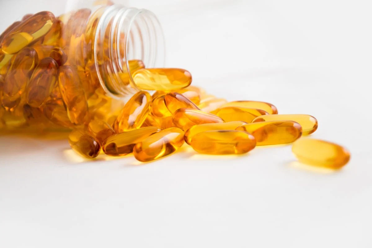 White metformin tablets on a surface representing diabetes medication