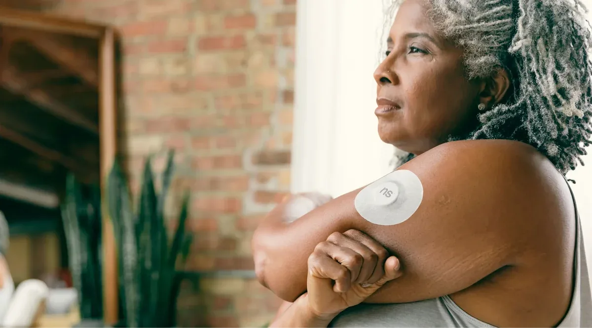 Woman with continuous glucose monitor (CGM) device — Twin Health diabetes reversal review